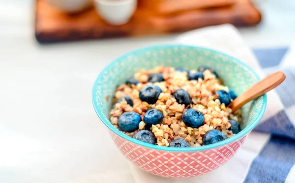 High protein healthy breakfast, buckwheat porridge with blueberries, flax seeds