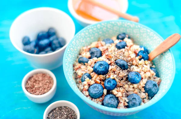 High protein healthy breakfast, buckwheat porridge with blueberries, flax seeds