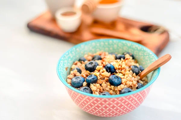 High protein healthy breakfast, buckwheat porridge with blueberries, flax seeds