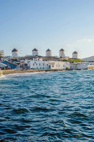 A number of mills on the hill near the sea on the island of Mykonos in Greece - the main attraction of the island