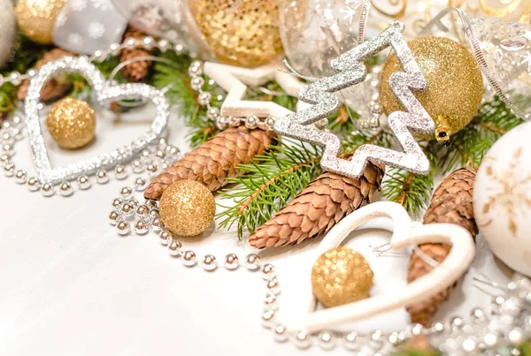 abstract christmas decor in gold and white caves with christmas toys and decor