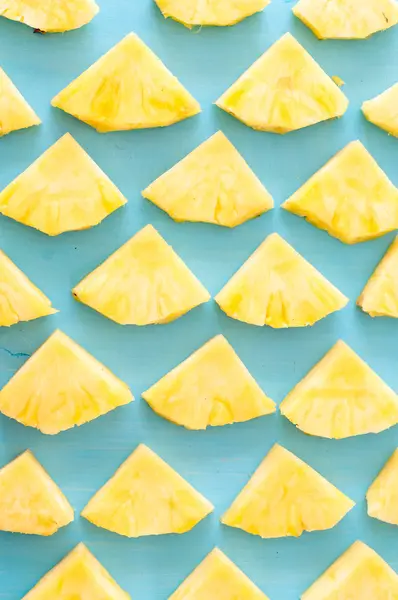 Pattern of Sweet pineapple on blue background top view, flat lay — Stock Photo, Image