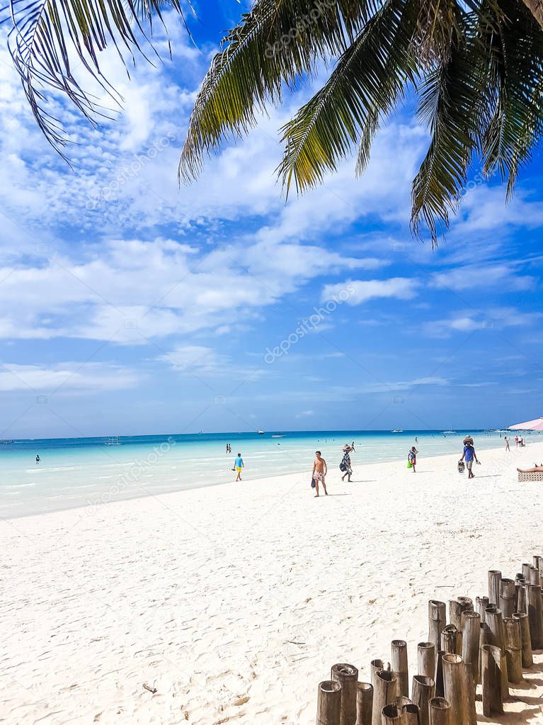 January 6, 2018, Boracay, Philippines, white beach, station 1, a typical day on the beach, resting tourists walk along the beach,