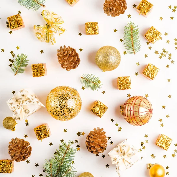 Christmas composition, balls, golden decorations on white background. Flat lay, top view, copy space