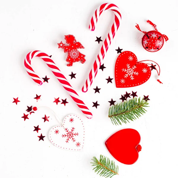 Creative arrangement of bright red christmas tree made of christmas ball, sweets, toys on white background. flat lay, top view — Stock Photo, Image