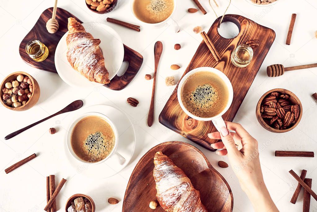 breakfast pattern, croissant, coffee, honey, cinnamon sticks, nuts, sugar. Good morning concept.