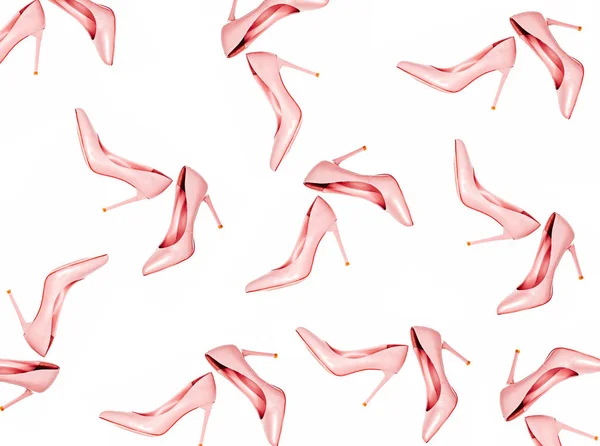 Pale pink female shoes pattern on pink coral background. Flat lay, top view trendy fashion feminine background. Beauty blog concept. — Stock Image Pale pink female shoes pattern on pink coral background. Flat lay, top view trendy fashion feminine background. Beauty blog concept. Royalty Free Stock Images