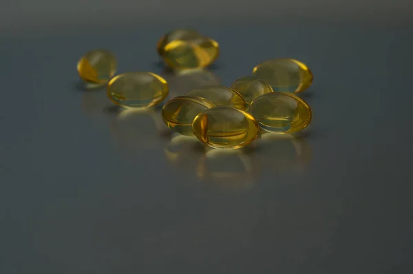 Bright Yellow Omega3 Pills Gray Background — Stock Photo, Image