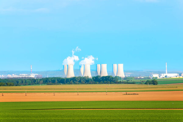 Agricultural fields with cooling towers of nuclear power plant i