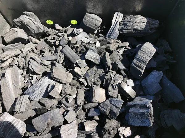 Black coal with ash in the grill
