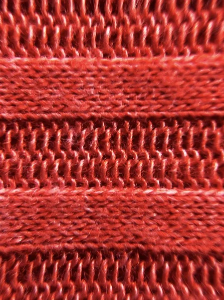Beautiful texture red knitted fabric close up