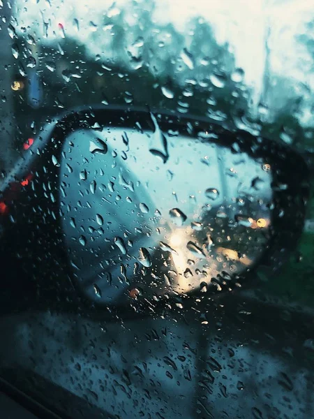 Beautiful view of the mirror and rain from the car