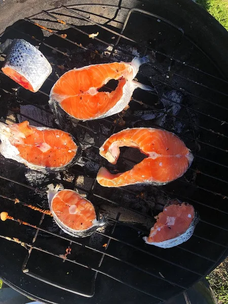 Fresh salmon on the grill in the garden