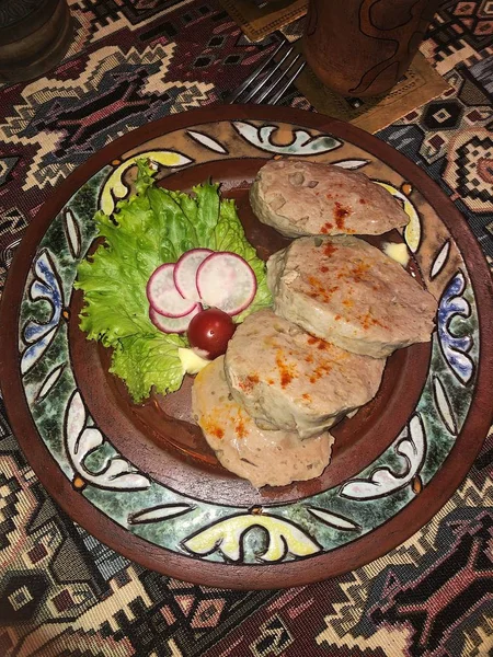 Delicious meat souffle with salad in a cafe