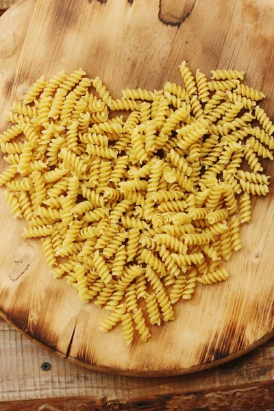 Pasta in the shape of a heart on the table — Stock Image Pasta Shape Heart Table Stock Photo