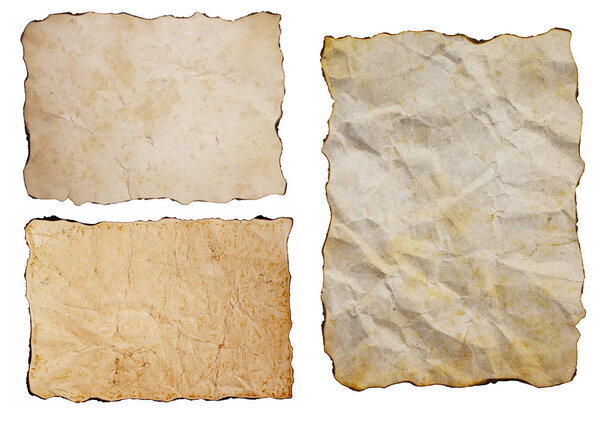 Old vintage grunge yellow brown sepia antique papers set isolated on white background. Three sheets of aged ancient burned paper.