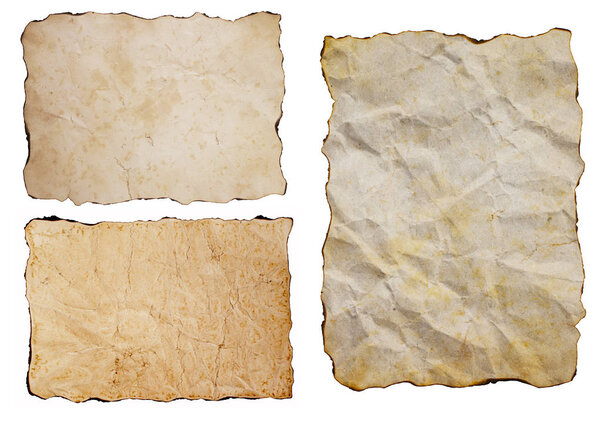 Old vintage grunge yellow brown sepia antique papers set isolated on white background. Three sheets of aged ancient burned paper.