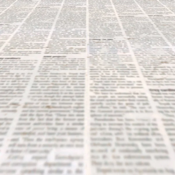 Newspaper texture with old unreadable text. Vintage blurred paper news square background. Textured page. Gray beige sheet. Front top view.