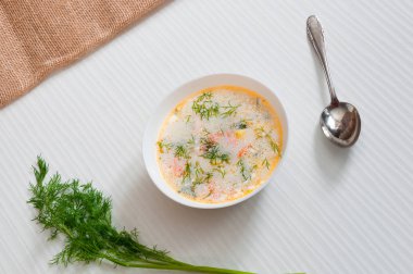 the white plate with fish soup