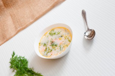 the white plate with fish soup