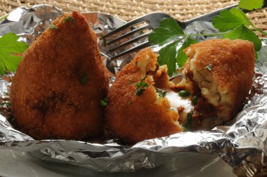 Open arancino, showing the rice and rag stuffing clipart