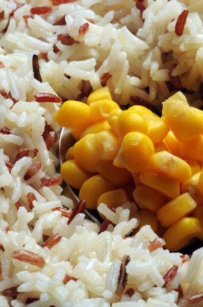 Close up on rice salad with corn kernels