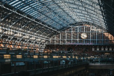 London, UK - July 26, 2018: Interior of St. Pancras station, view from above. St. Pancras is one of the largest railway stations in London and a home to Eurostar. clipart