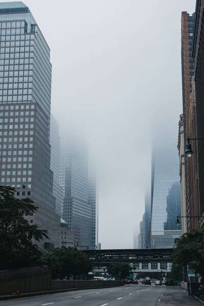 New York, USA - June 1, 2018: Skyscrapers disappear in the fog in New York, USA. New York is one of the most visited cities in the world.