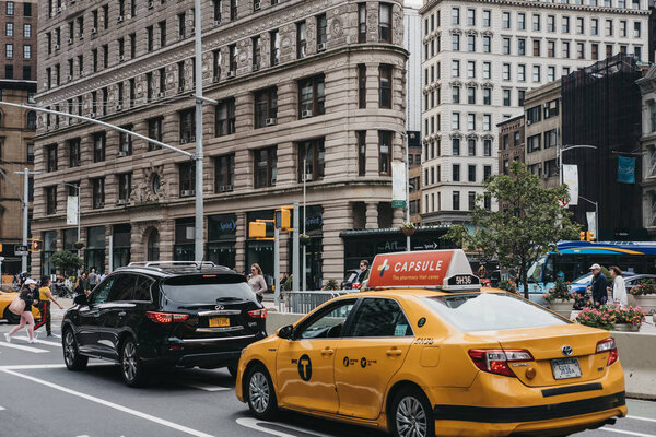 New York, USA - May 28, 2018: Numerous yellow taxis on the street in New York. Yellow taxis are recognised worldwide as the icons of the city.