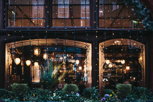 Christmas lights on the windows of a Crown & Anchor pub in Coven — Stock Photo, Image