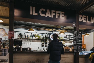 London, UK - January 13, 2019: People inside Mercato Metropolitano, the first sustainable community market in London focused on revitalising the area and protecting environment.