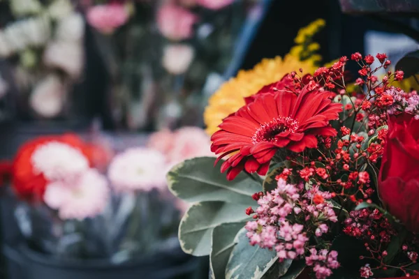 Variety of fresh flowers on sale at a street market.