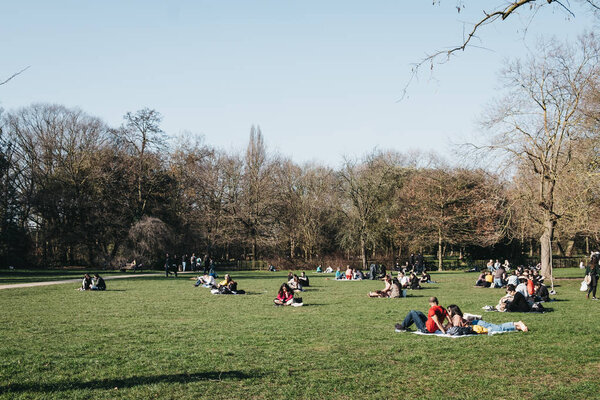 People relaxing in Holland Park, London, UK, on the hottest sprin
