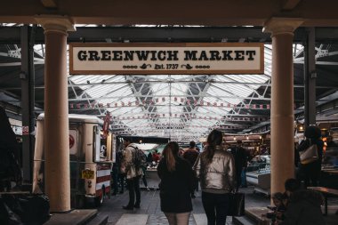 People entering Greenwich Market, London's only market set withi clipart