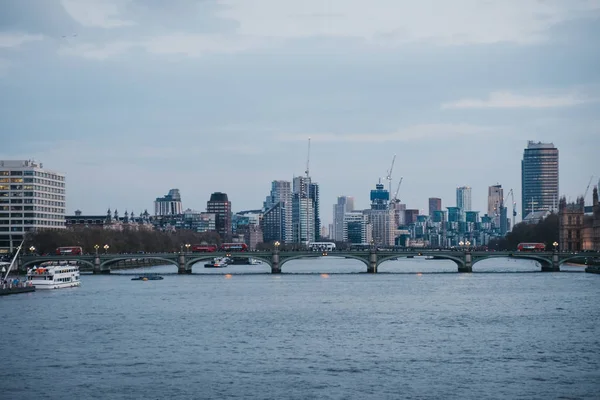 View of London skyline and landmarks from Millennium Bridge duri — Stock Photo, Image