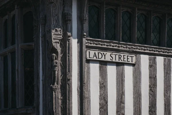 Lady Street street name sign on half-timbered house in England,