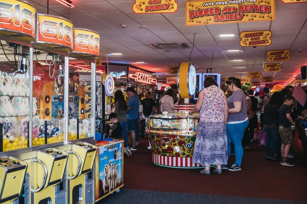 People playing at the arcade by the seaside in Cromer, Norfolk, — Stock Photo, Image