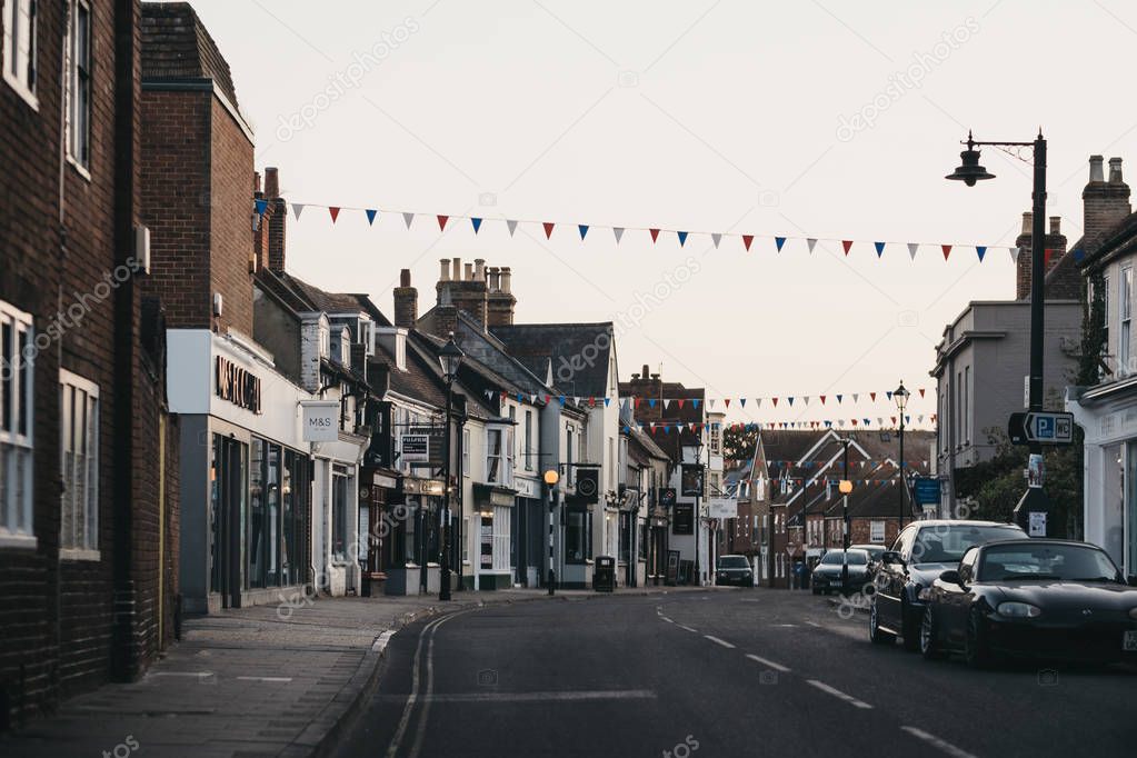 Shops and restaurants on a street in Lymington, New Forest, UK.