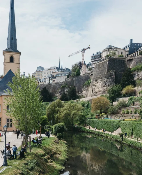 High angle view of people relaxing by river Alzette in Luxembour — Stock Photo, Image