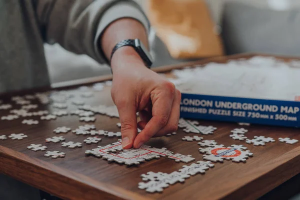 London May 2020 Male Hand Placing Piece Incomplete Puzzle Iconic — Stock Photo, Image
