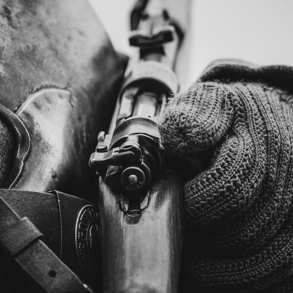 German rifle bolt in the hands of a soldier of the Second World 