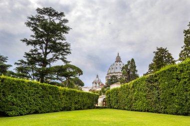 VATICAN, VATICAN CITY - JUNE 16, 2014: View at Vatican Gardens with beautiful landscaping, green lawns and trees, Rome, Italy. clipart