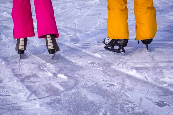 Legs Teenagers Girls Boys Bright Pink Yellow Clothes Ice Skates — Stock Photo, Image