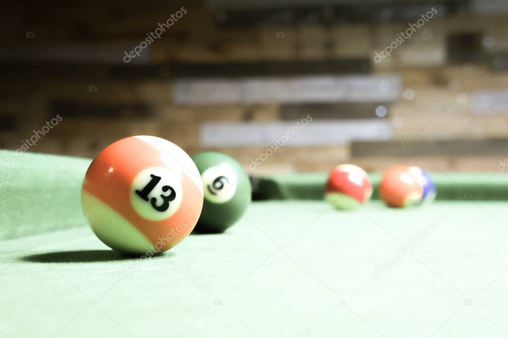 Billiards balls on a green table