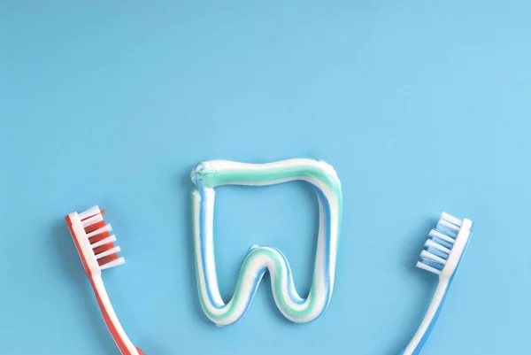 tooth cleaning concept with toothbrush and toothpaste