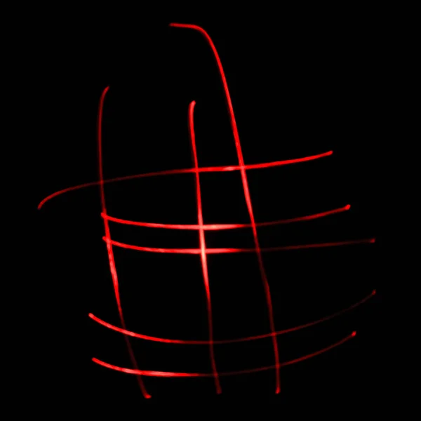 Abstract red light. Wandering red light in the dark. Black background with red abstract lines.