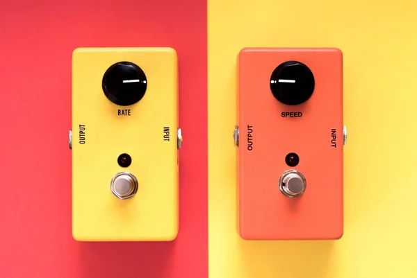 Yellow and orange guitar stomp boxes. Guitar effect pedal. Yellow and orange effect pedal.