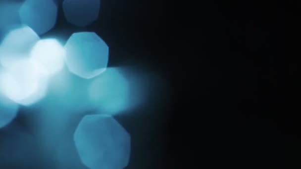 Natural blue crystal bokeh in the dark. Creative motion background. — Stock Video