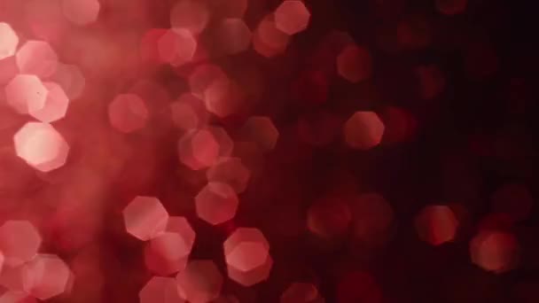 Abstrakta blanka glitter partiklar. Abstrakt bakgrund med röda lysande bokeh gnistrar. Skimmer ljus. — Stockvideo