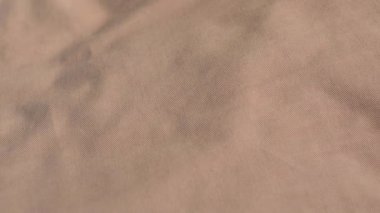 Pürüzsüz, kemik kahverengi Pamuk Kumaş Tekstil dükkanda closeup çekim.